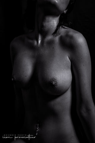 Fine art black and white close-up of a nude torso with goosebumps and glistening skin, intimate, textured, and sensual, part of the Icon experience at Icon Provocateur.